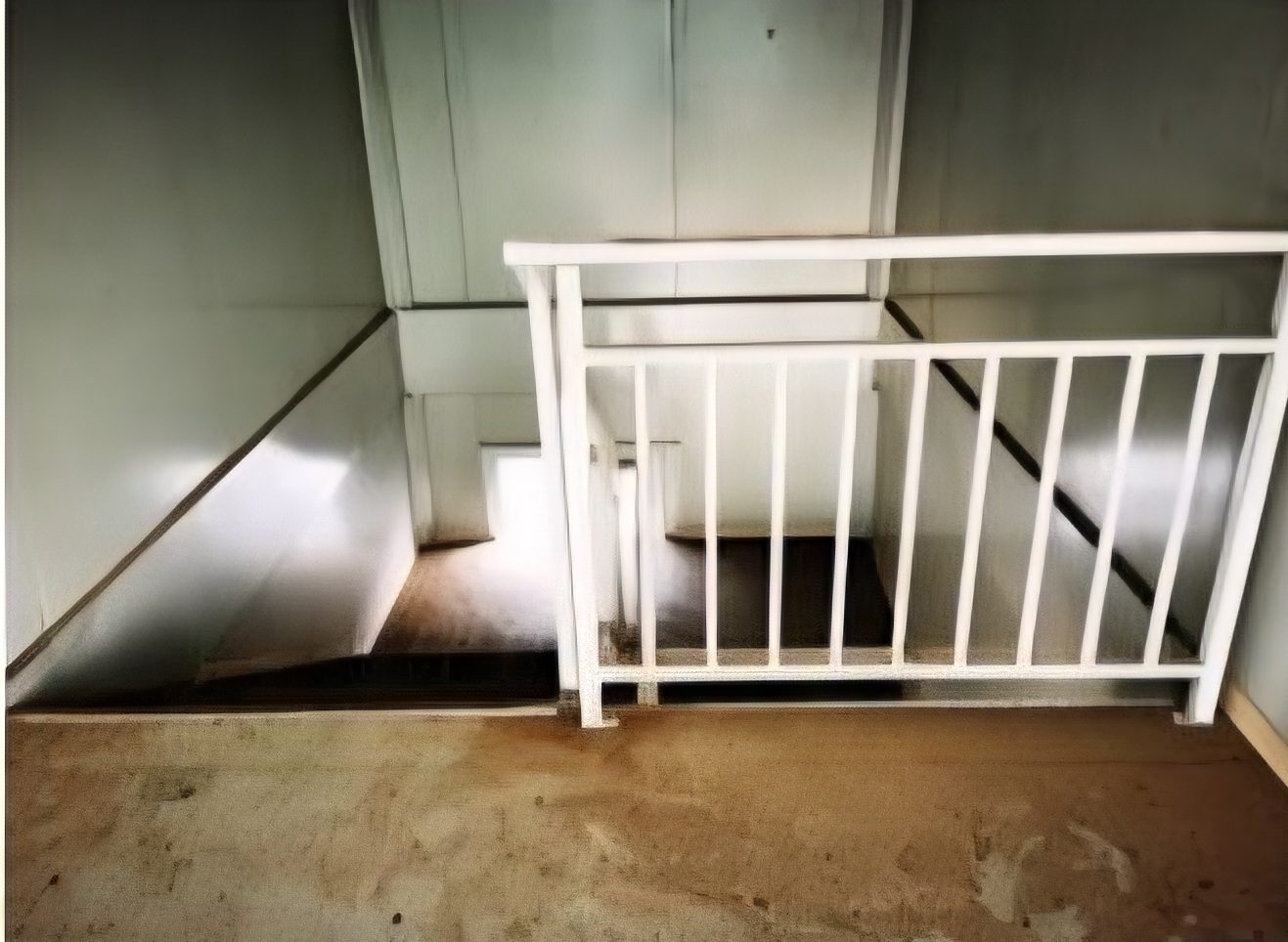 Stairwell floor before cleaning and restoration